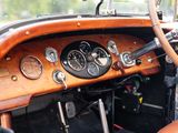 a steering wheel and dashboard of an old car