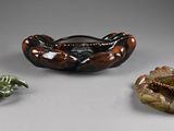 three pieces of art that are sitting on a table