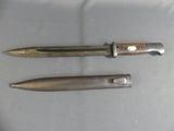 two knives that are sitting next to each other on a table