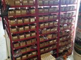 many boxes and tools on the shelves in the warehouse