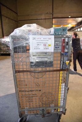 a cart with a lot of boxes on it in a warehouse