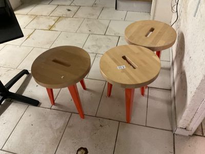 three stools that are sitting on the floor