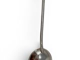 a metal ball hanging from the side of a wall