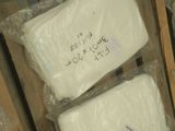 two packages of soap sitting on top of a pallet