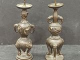 two candles that are sitting on a table