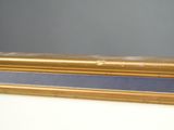 a close up of a gold frame with a blue border