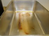 a dirty sink with a lot of water in it