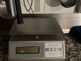 an image of a digital scale on a kitchen counter