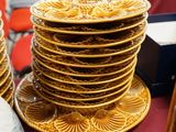 a lot of plates and bowls on the table