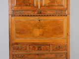 an old wooden cabinet with drawers and drawers on top of it
