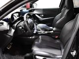 a picture of the inside of a car with black leather seats