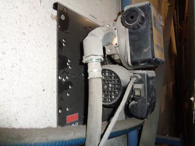a picture of a water heater with a hose attached to it