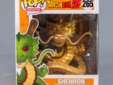 a close up of a dragon figurine in a box