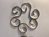 a metal object that looks like a spiral design