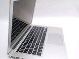 a close up of a laptop computer on a white surface