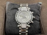 an image of a diamond watch in a box on a pillow