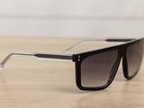 the sunglasses are on the table ready to be worn