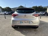 the rear end of a silver car parked in a parking lot