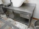 a large white bucket sitting on top of a stainless steel table