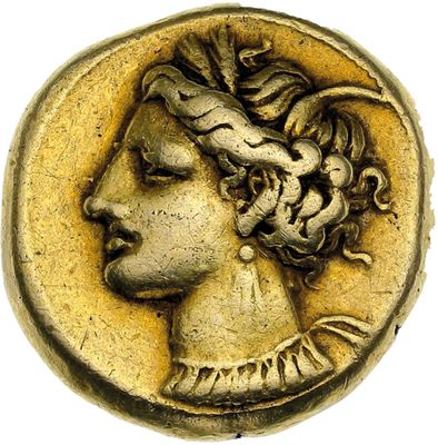 gros plan d'une pièce de monnaie sur laquelle figure un visage de femme