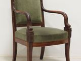 an image of a chair with a green upholstered seat
