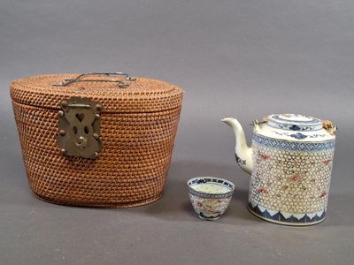 a basket and a teapot sitting next to each other