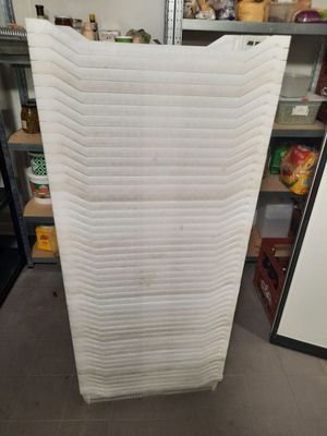 a picture of a stack of mattresses in a store