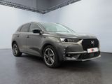 the new dsx suv is parked in a large room