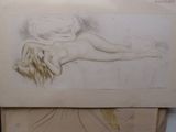 a drawing of a woman laying down on a bed