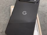 the back of a black google pixel phone sitting on top of a box