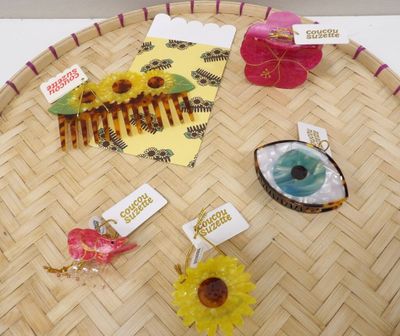 a lot of hair accessories that are on a tray