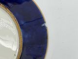two plates that have blue and white designs on them
