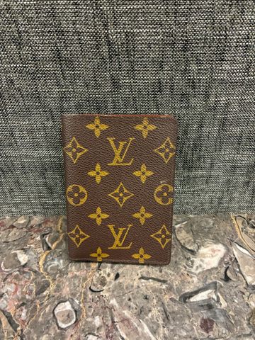LOUIS VUITTON Paris - Portefeuille en toile monogrammée. État neu...