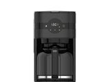 a black coffee maker sitting on top of a white surface