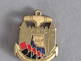une image représentant une médaille d'or sur laquelle figure un château