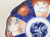 a blue and white plate with a design on it