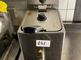 a machine that is sitting on the counter in the kitchen