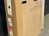 a cardboard box that is sitting on the ground