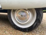 a close up of a tire on a white truck