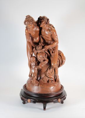 une image représentant une statue de deux hommes et d'un chien