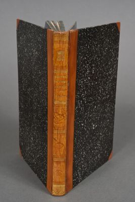 an image of a book with a wooden cover and a bookmark