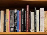 a book shelf with many books on top of it