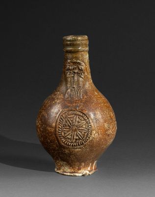 an image of a brown vase with a man on it