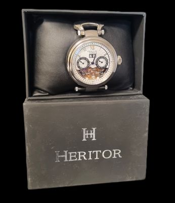 an image of a watch in a box on a black background