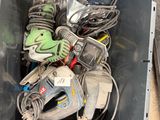 a metal container filled with assorted tools on the floor