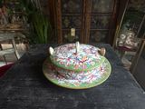 a cake with a candle on top of it on a table