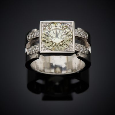 an image of a diamond ring on a black surface