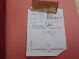 a piece of paper with a note attached to it