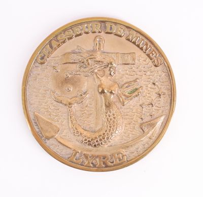 une image représentant une pièce d'or sur laquelle figure une sirène