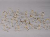 a lot of gold colored metal objects on a white surface
